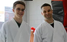 a couple of men in white lab coats