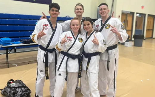 a group of people in karate uniforms