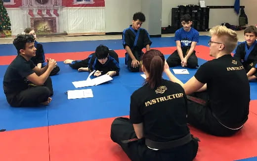 a group of people sitting on the floor