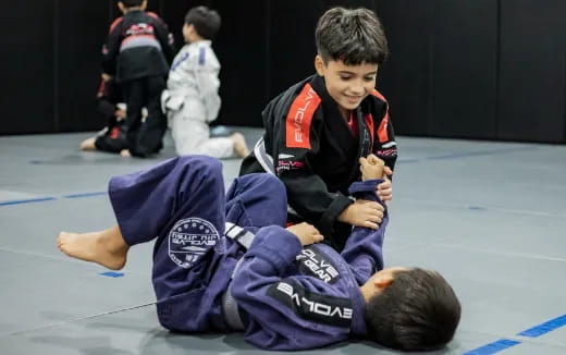 a boy and a girl in a gym