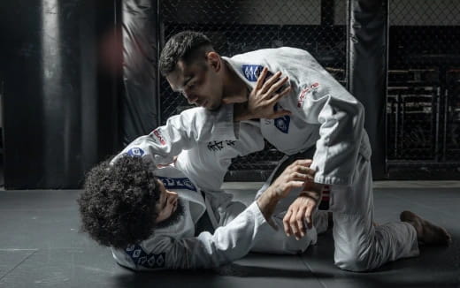 a man kicking another man