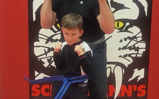 a boy holding a baby