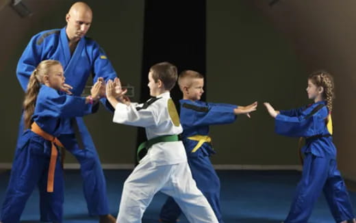 a group of people in karate uniforms