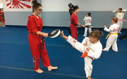 a group of people in karate uniforms