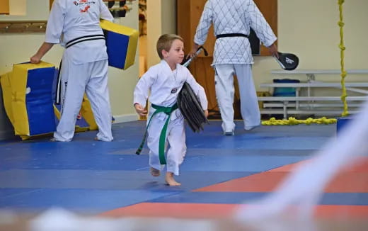a boy in a karate uniform