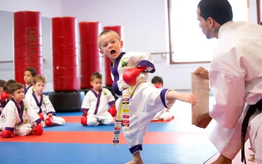 a group of kids in a karate class