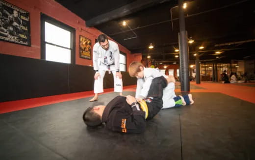 a man kicking another man in the face