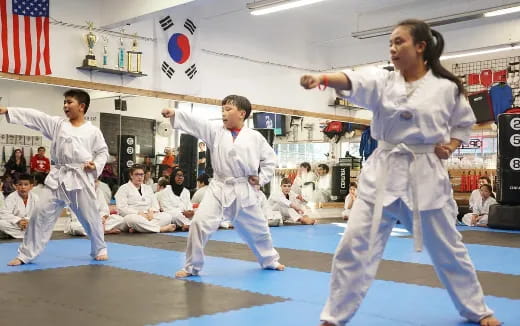 a group of people in karate uniforms