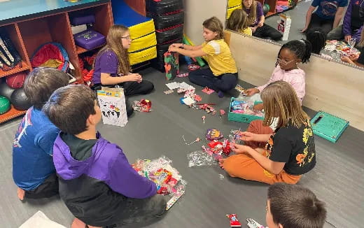 a group of children sitting on the floor