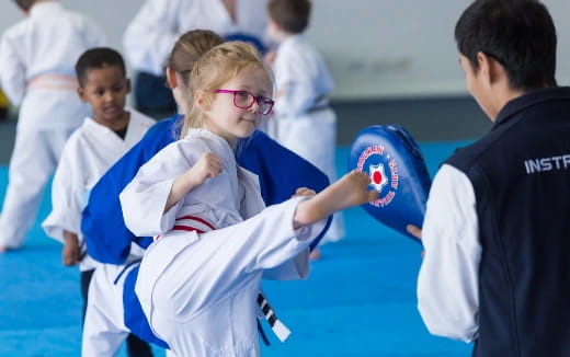 a group of people in karate uniforms