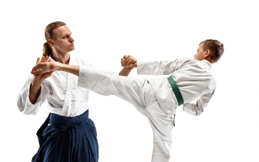 a man and a woman in karate uniforms