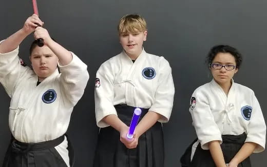 a group of boys in karate uniforms