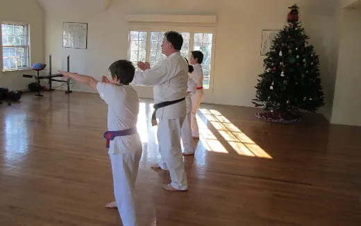 a group of people in karate uniforms