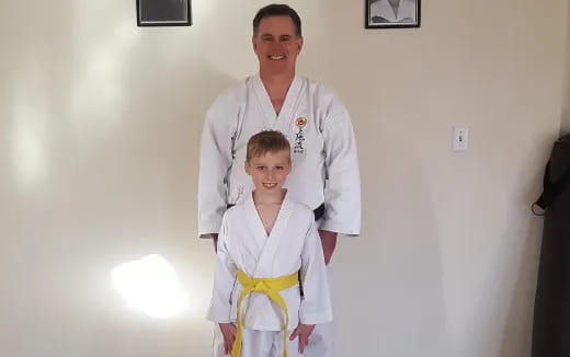 a man and a girl in a room