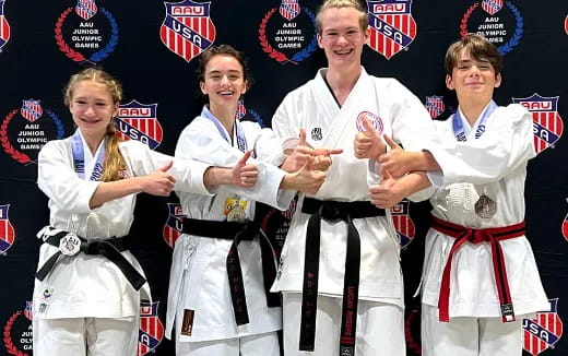 a group of people wearing white outfits