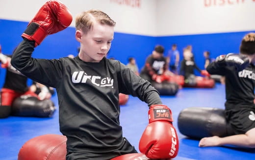 a boy in boxing gloves