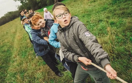 a group of people in a grassy area