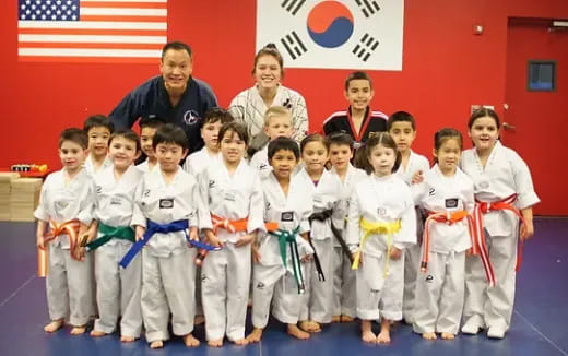 a group of people in karate uniforms