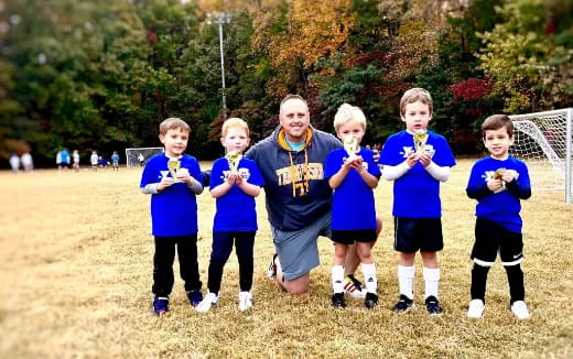 a group of kids posing for a picture