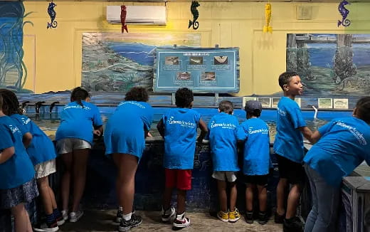 a group of people in blue shirts