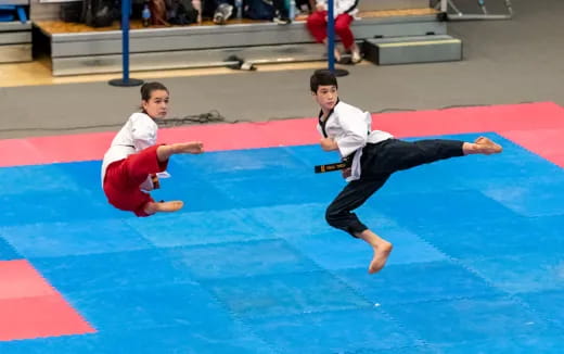 two boys in karate uniforms