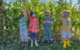 a group of children wearing face masks