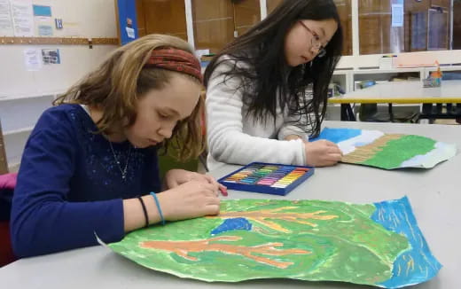 a few young girls painting