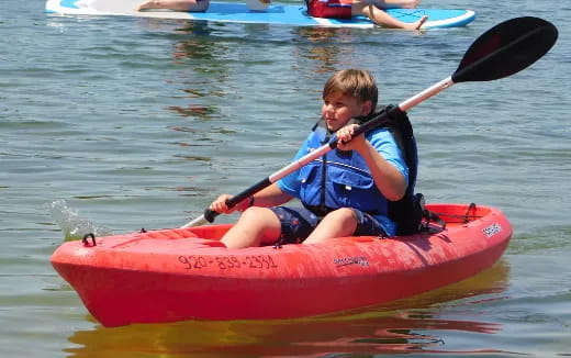 a boy in a kayak
