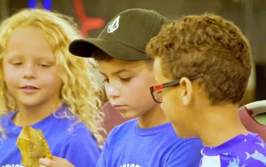 a group of children looking at something