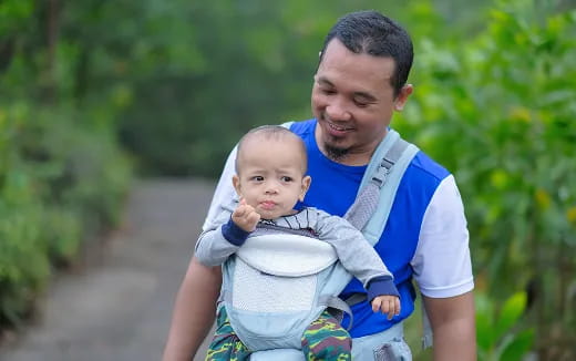 a person holding a baby