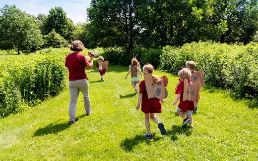 a group of people walking in a field
