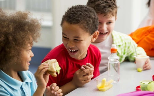 a group of kids eating