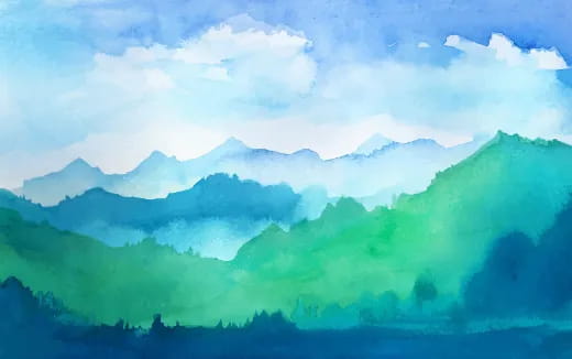 a mountain range with clouds