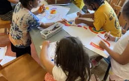 a group of children painting