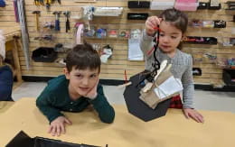 a few children sitting at a table