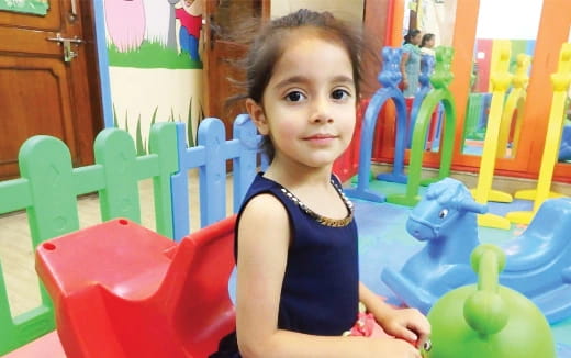 a child sitting in a playground