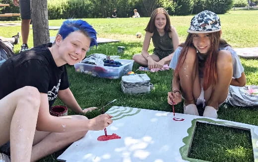 a group of people painting