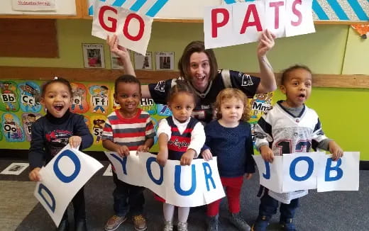 a group of children holding signs