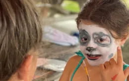 a child with a face paint