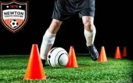 a football player kicking a ball