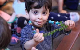 a child holding a toy