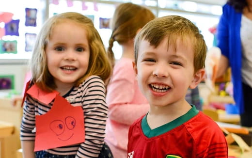 a couple of children smiling