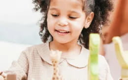 a young girl smiling