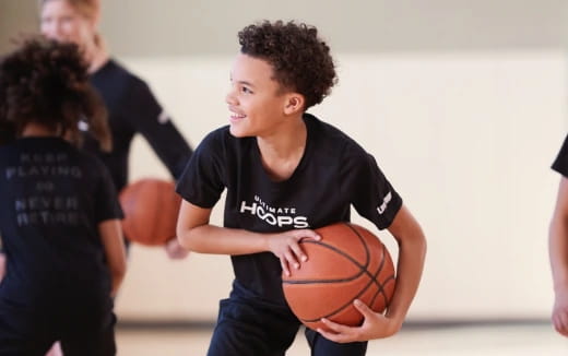 a boy holding a basketball