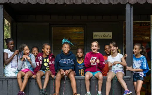 a group of people sitting on a bench