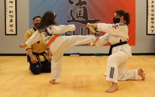 a group of people in karate uniforms