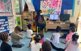 a teacher teaching her students