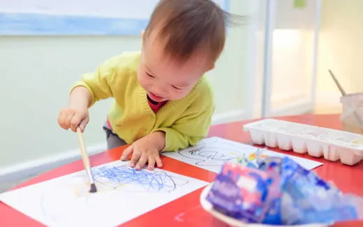 a young boy painting