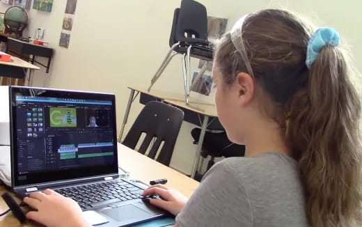 a woman using a laptop