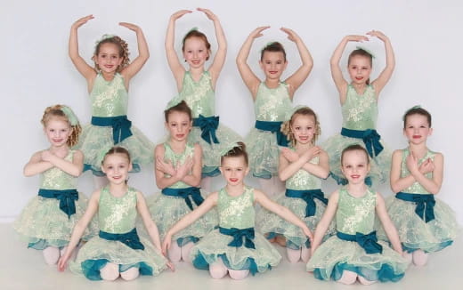 a group of children in dresses